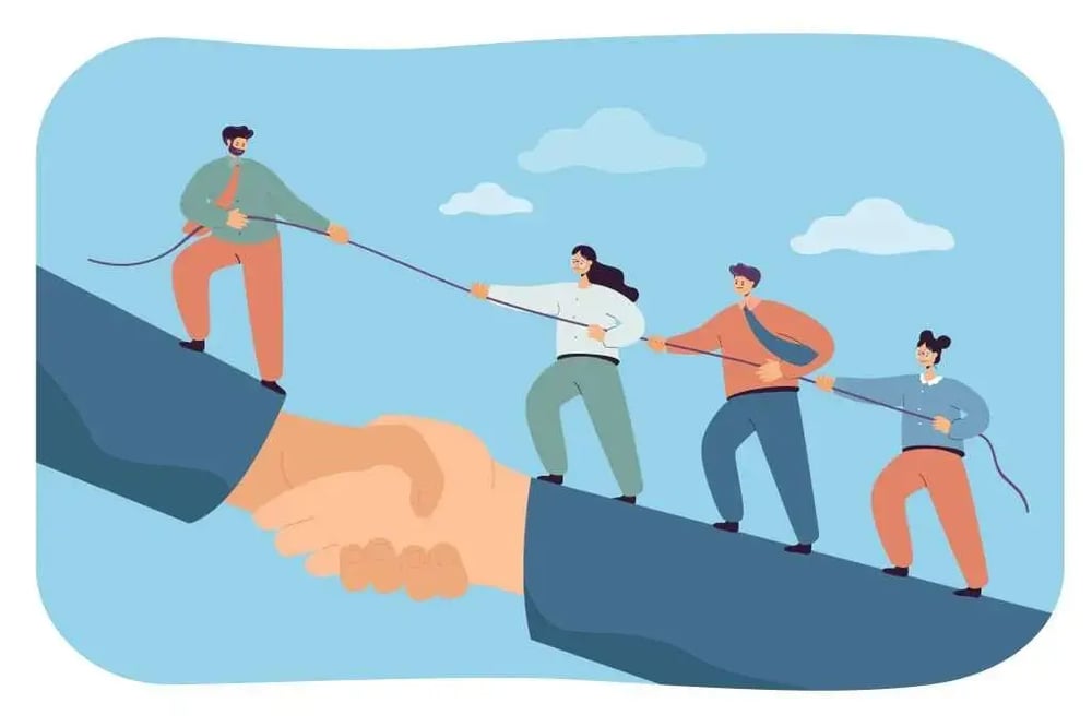 Business-team-climbing-giant-handshake-with-support-of-leader-1024x683